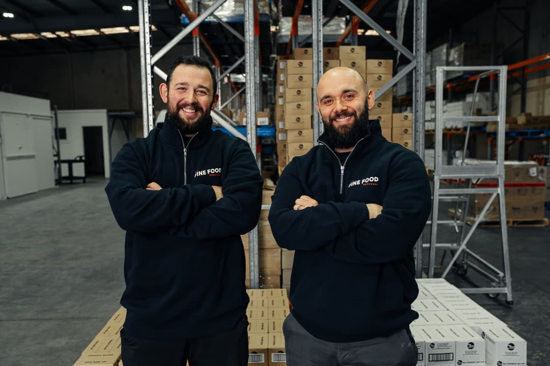 The Fine Food Merchant Owners standing in the food warehouse